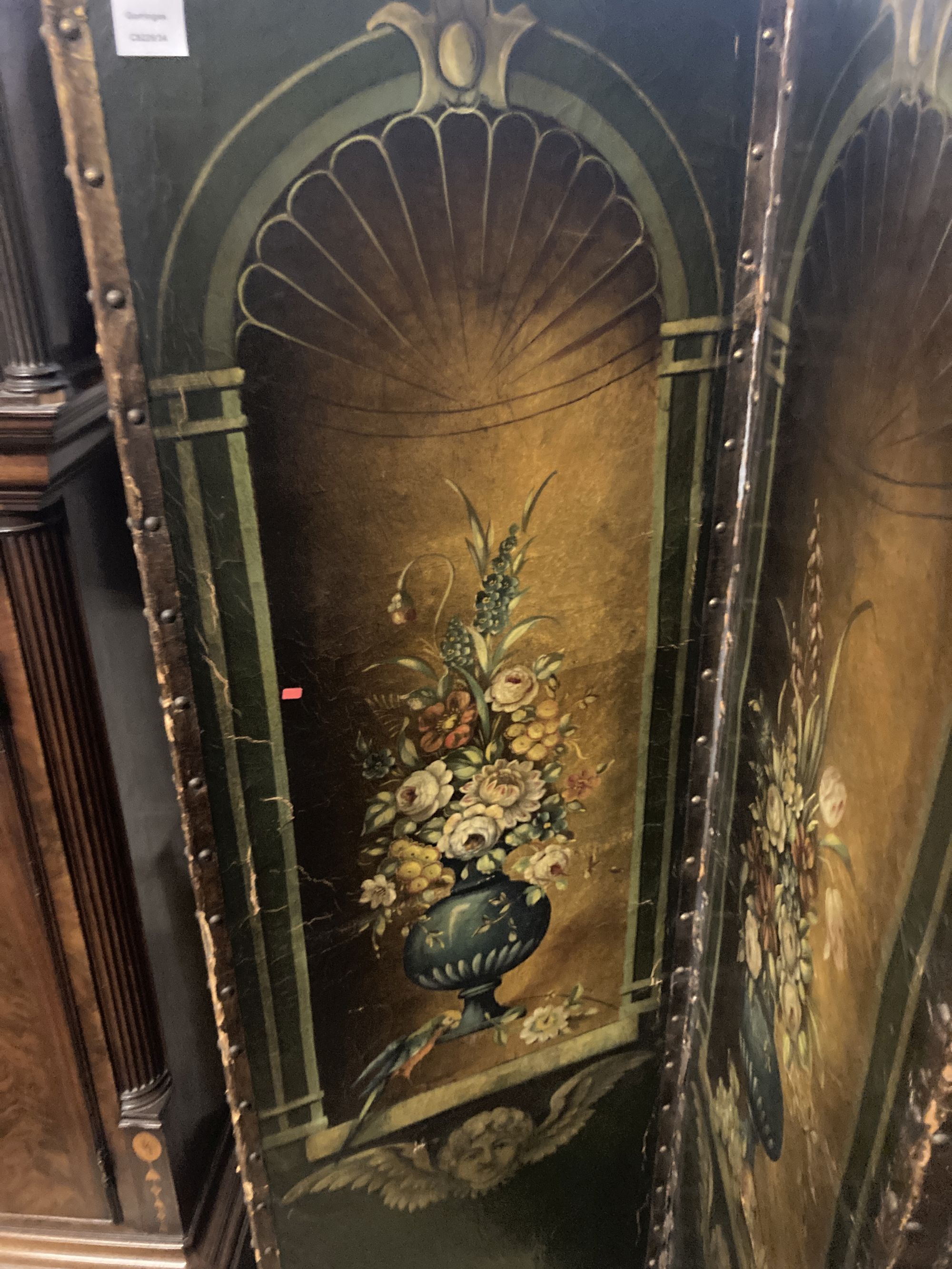 A 19th century Spanish leather four leaf draught screen, painted with vases of flowers, each panel width 53cm height 184cm